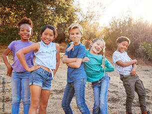 Portrait Of Multi-Cultural Children Posing And Hanging Out With Friends In Countryside Together Photos | Adobe Stock